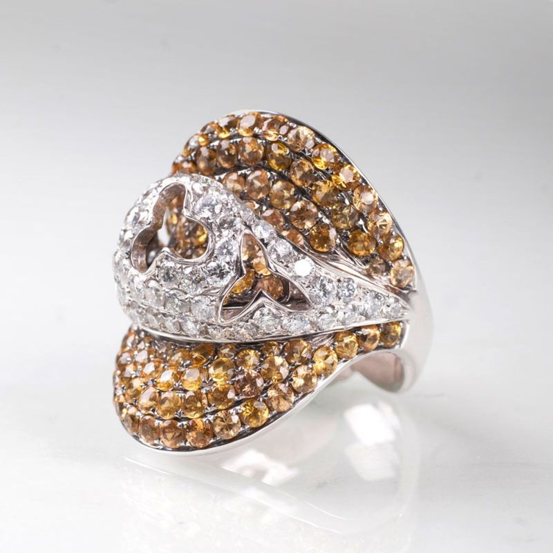 A diamond ring with yellow sapphires