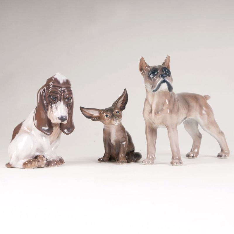 A set of 3 porcelain figures 'Basset, German boxer and desert fox'