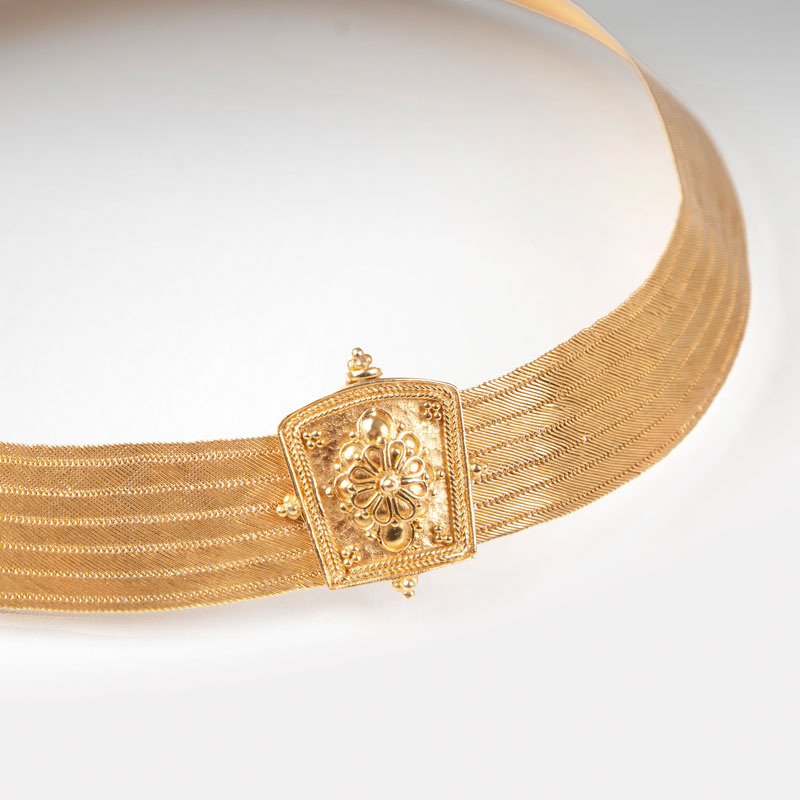 A golden necklace in Greek style