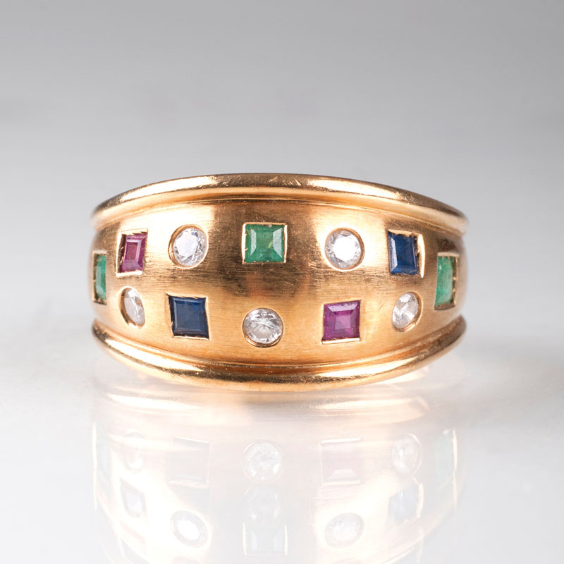 A golden ring with precious stones