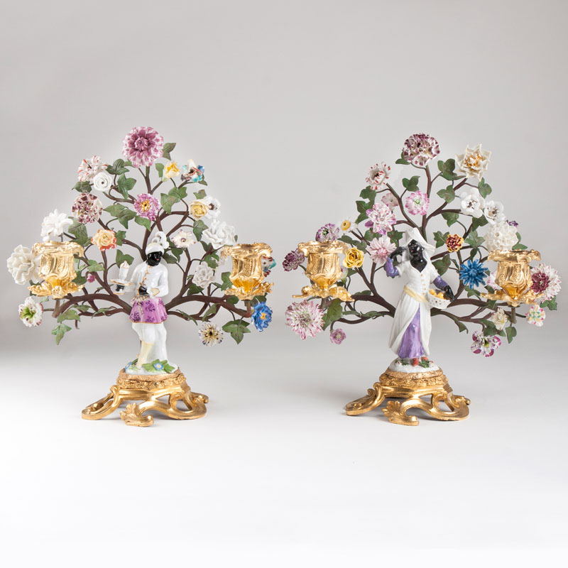 A pair of extraordinary ormolu candlesticks with Meissen figurines