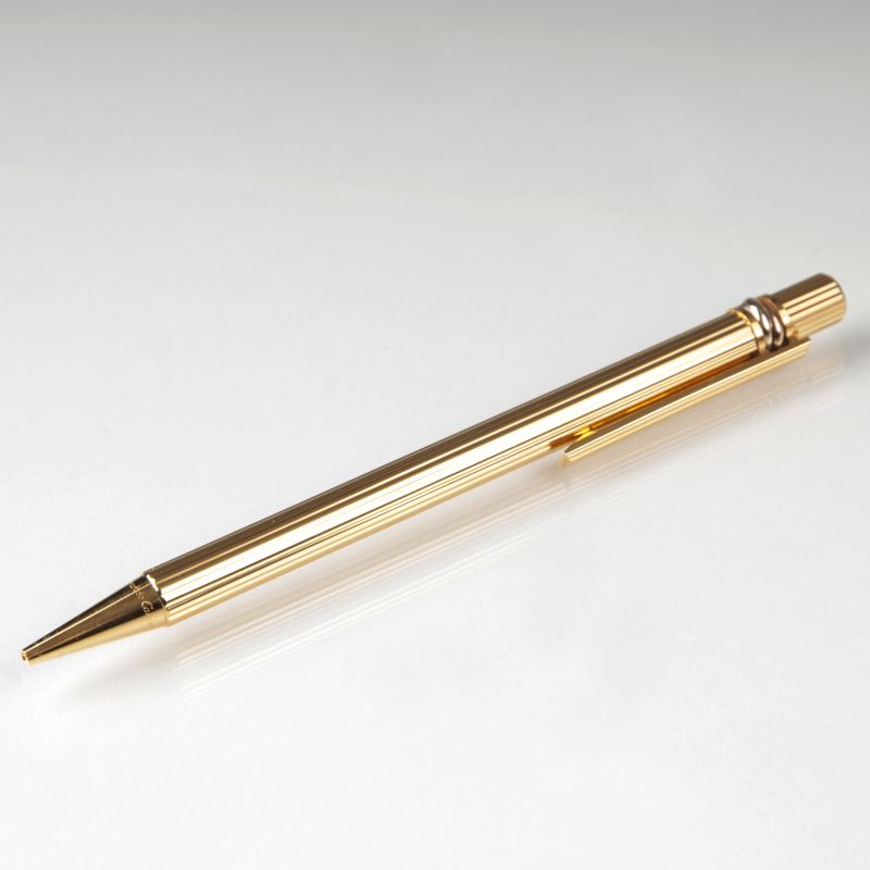 An elegant 'Must de Cartier Trinity' balloint pen