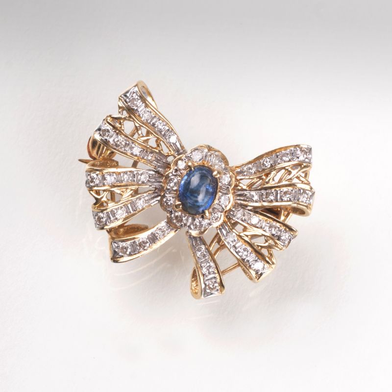 A petite sapphire diamond brooch A petite sapphire diamond brooch