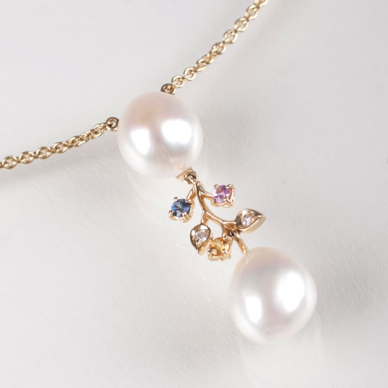 A pearl topaz pendant with necklace by Schoeffel