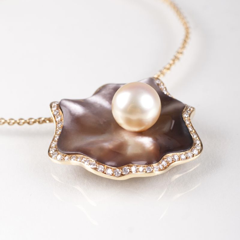 A mother-of-pearl diamond pendant with Southsea pearl and necklace by Schoeffel