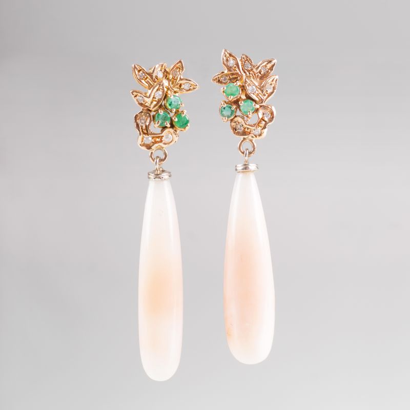 A pair of coral earpendants with small emeralds and diamonds