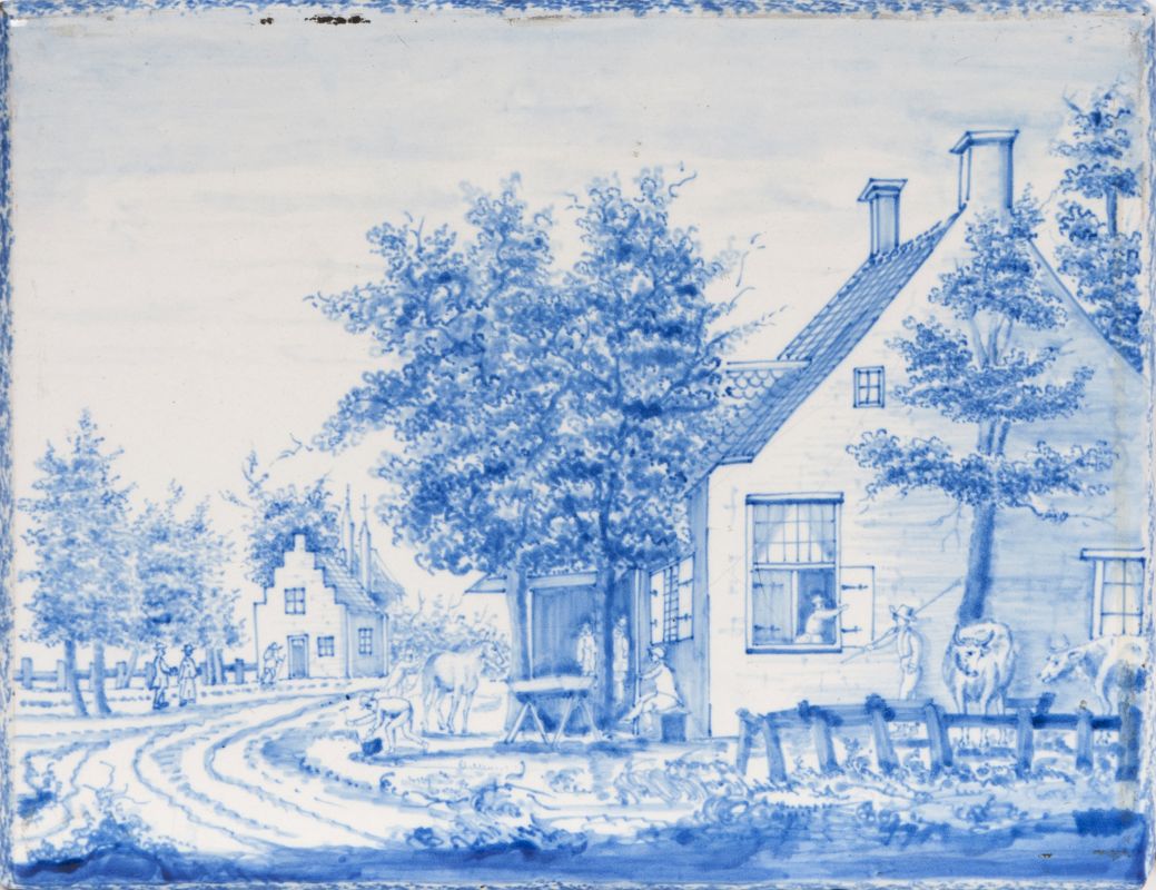 A faience blue and white plaque with rural landscape