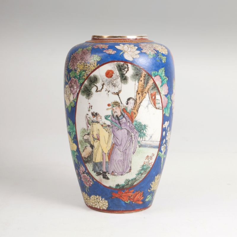 A small blue ground famille rose porcelain vase