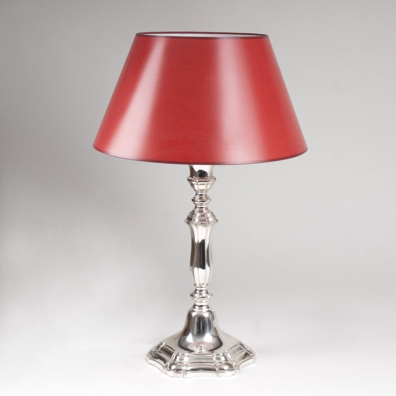 A great desk lamp with red lampshade