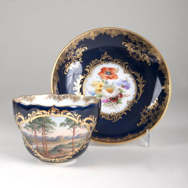 A Meissen cup with cobalt ground and a view to the landscape 'Bastei'