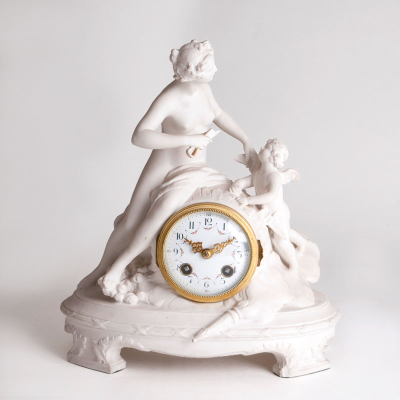 A biscuit porcelain mantel clock 'Flora and Cupid'