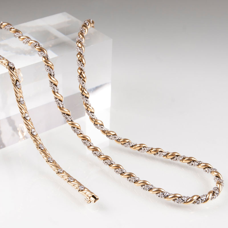 A golden necklace with a diamond bracelet