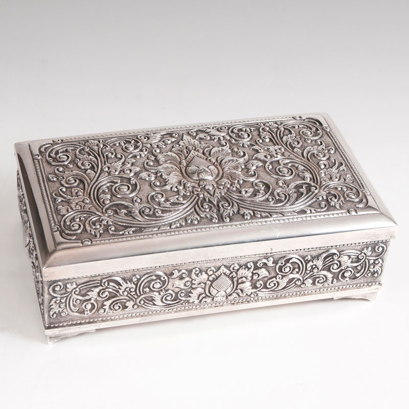 An silver box with flower tendrils - a present by the Indonesian President