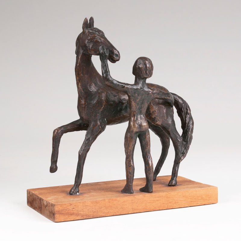 A bronze sculpture 'Naked youth with horse'