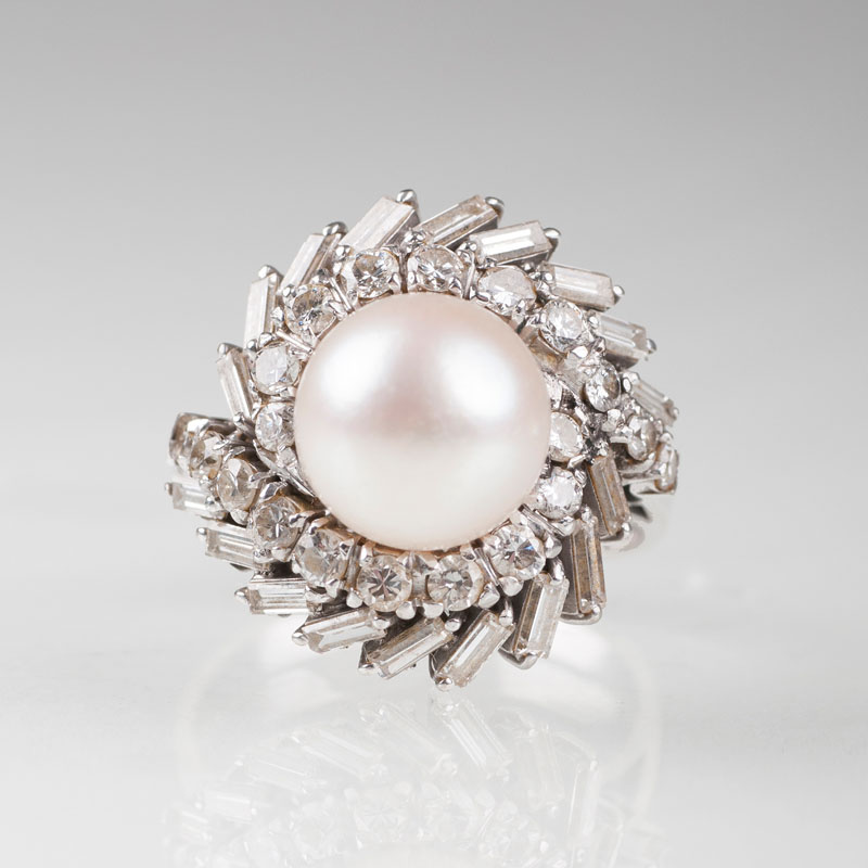 A Vintage diamond ring with one pearl