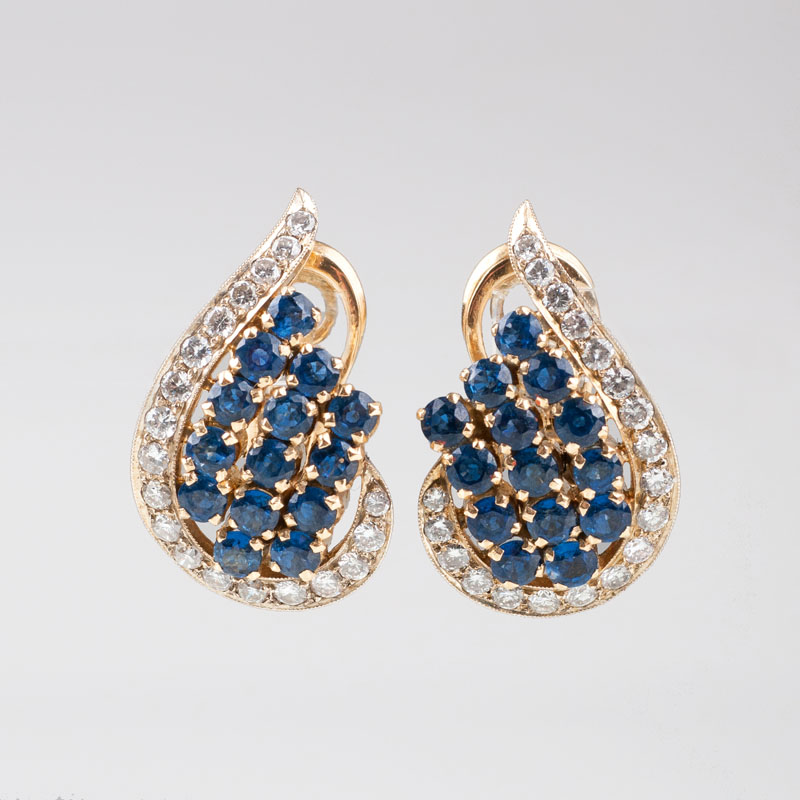 A pair of sapphire diamond earrings