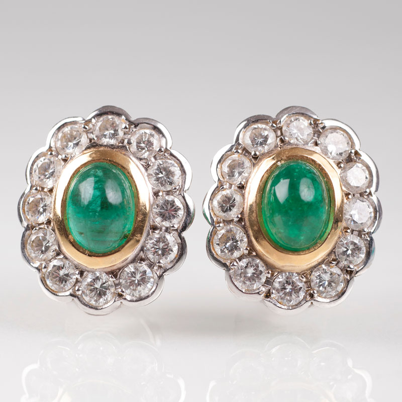 A pair of emerald diamond earrings