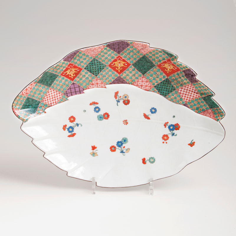 An early leaf shaped dish with chequered pattern and flowers in kakiemon style