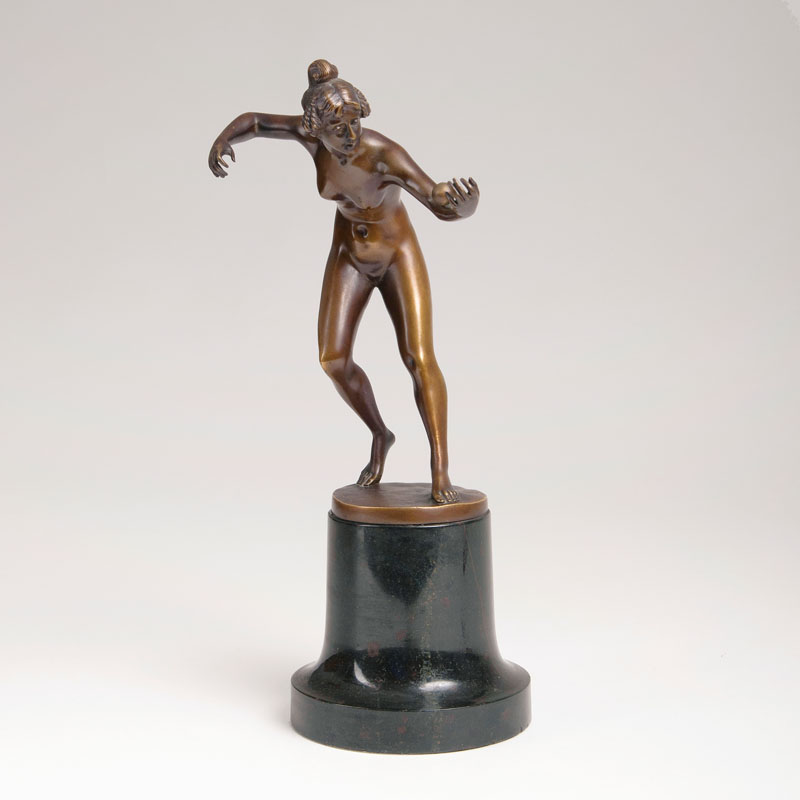 A bronze figure 'A ball playing female nude'