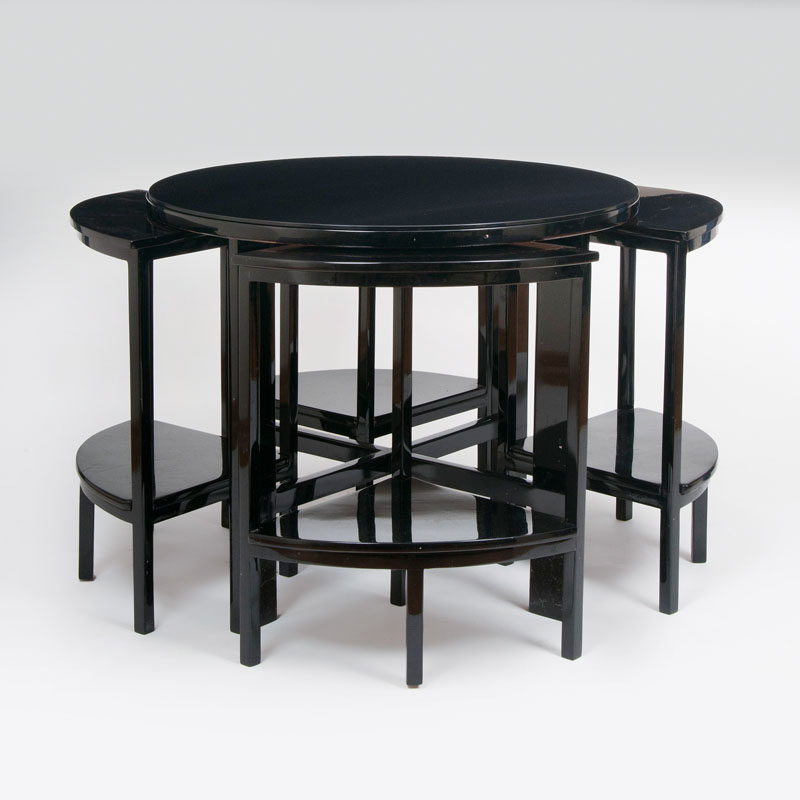 A round Art Deco side table with small segment-shaped tables