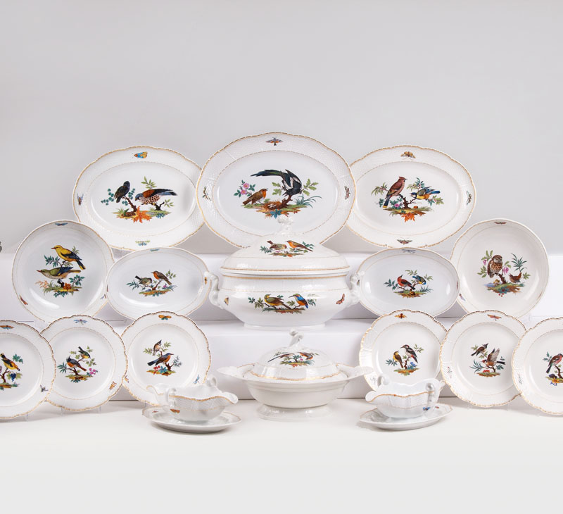 An extensive dinner service for 11-12 persons with bird painting An extensive dinner service for 11-12 persons with bird painting