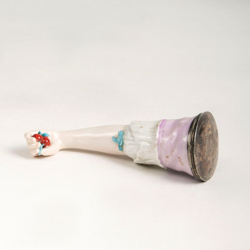 A porcelain aromatic box in shape of a girl's arm A porcelain aromatic box in shape of a girl's arm