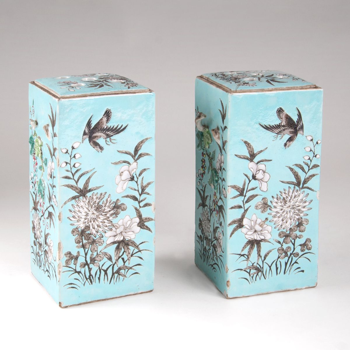 A pair of square-cut vases with branche-shaped handles