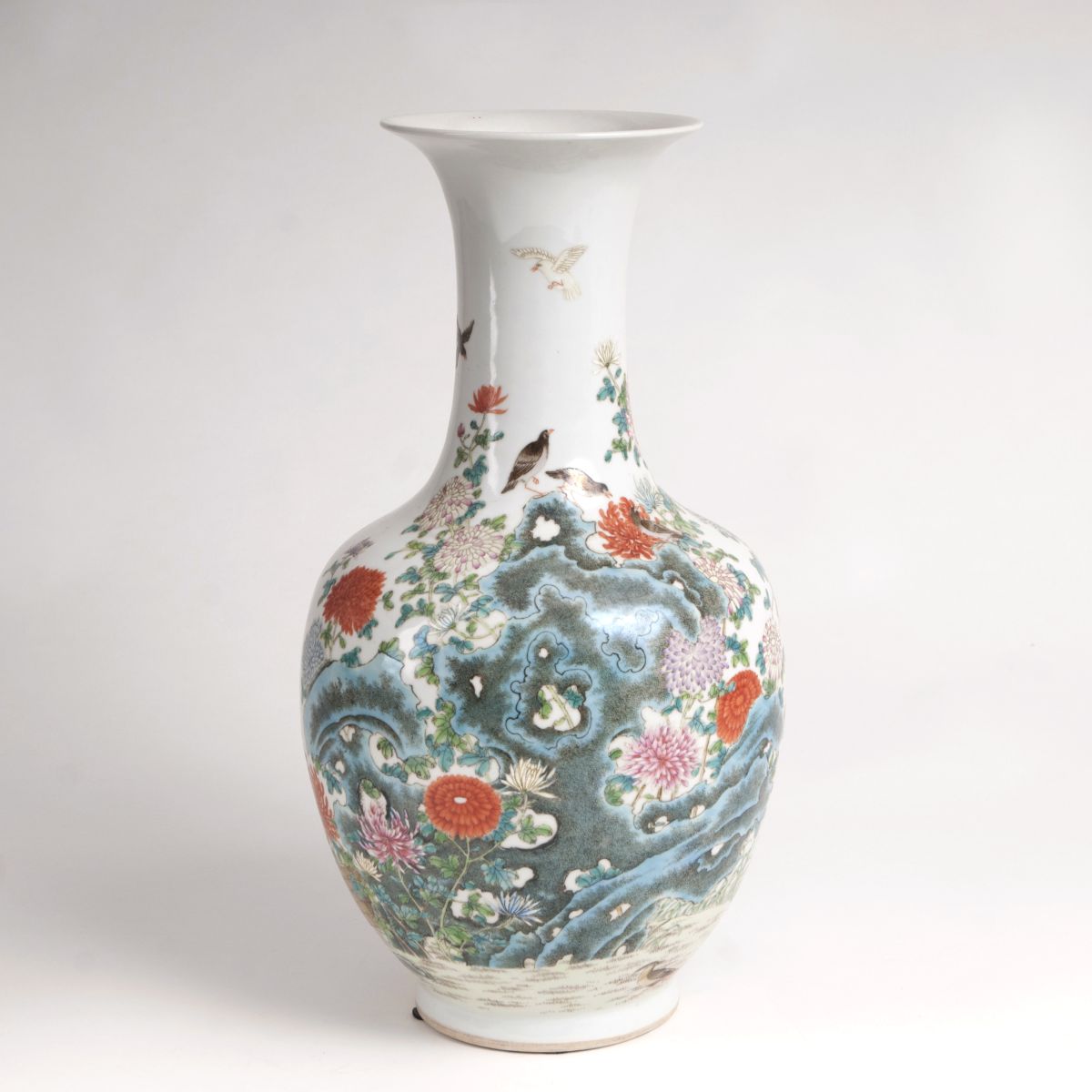 A baluster vase with birds on rocks