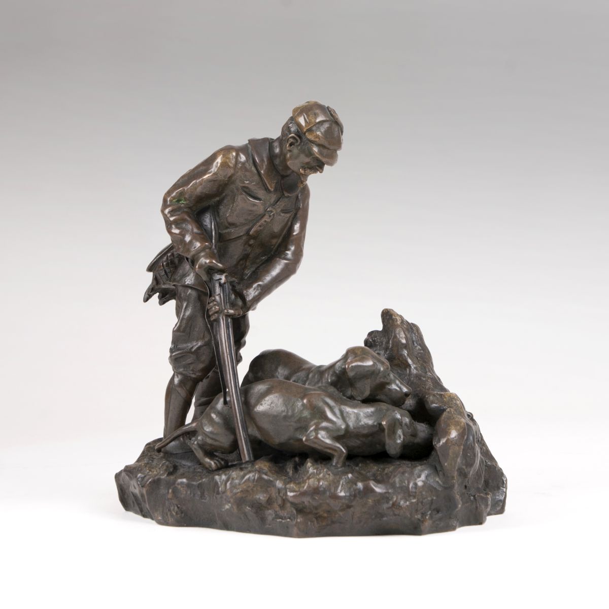 A bronze group 'Hunter with his two hounds'