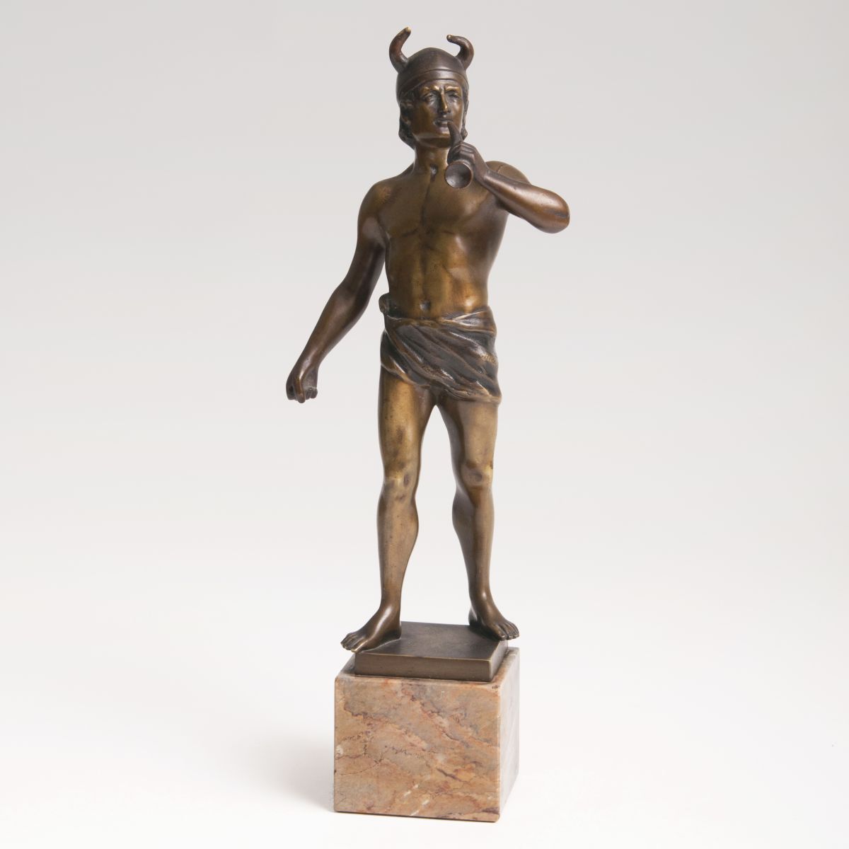 A bronze sculpture 'Germanic man with horn'