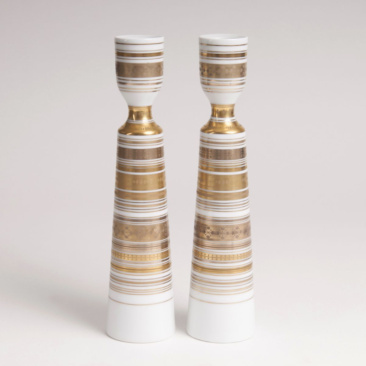 A pair of porcelain candlesticks from the series 'Quatre couleurs'