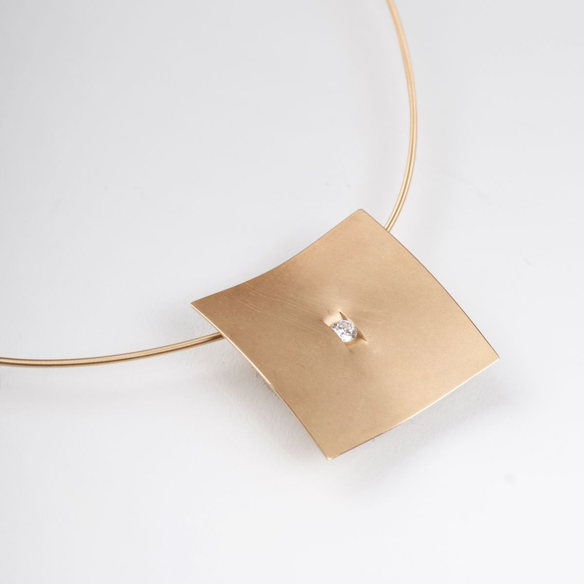 A golden necklace with solitaire pendant