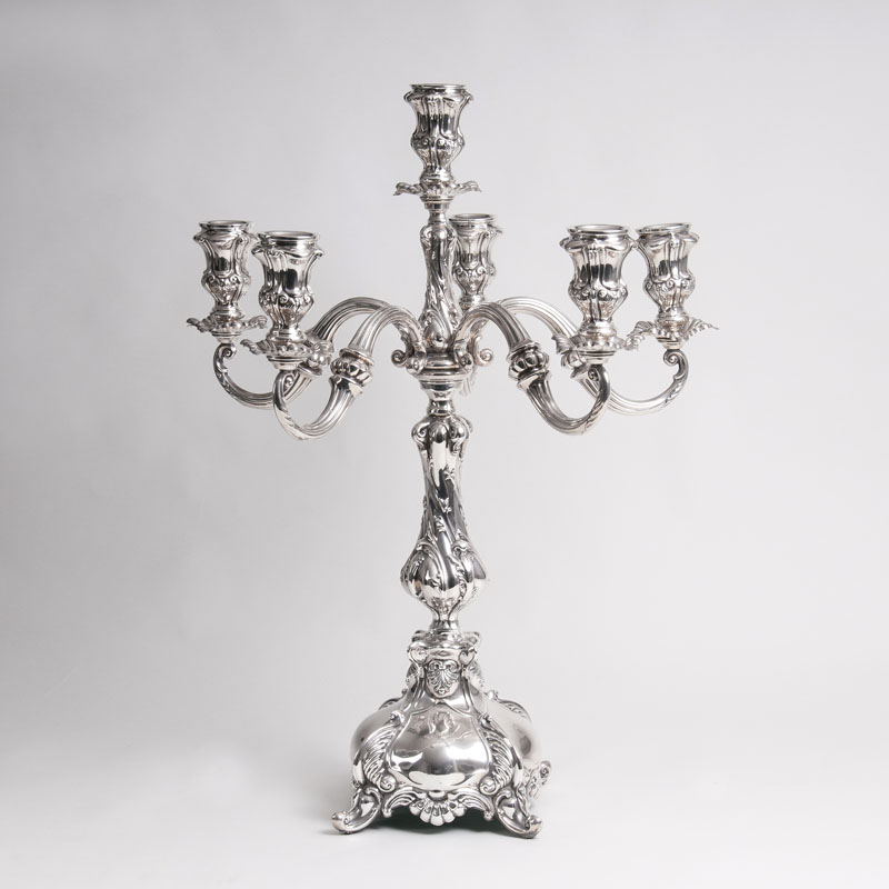 A very big pomp candelabra with 6 flames in a baroque style