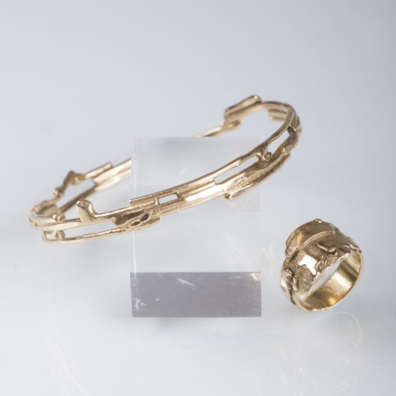 A golden bangle with matching ring