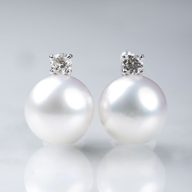 A pair of Southsea pearl solitaire diamond earrings