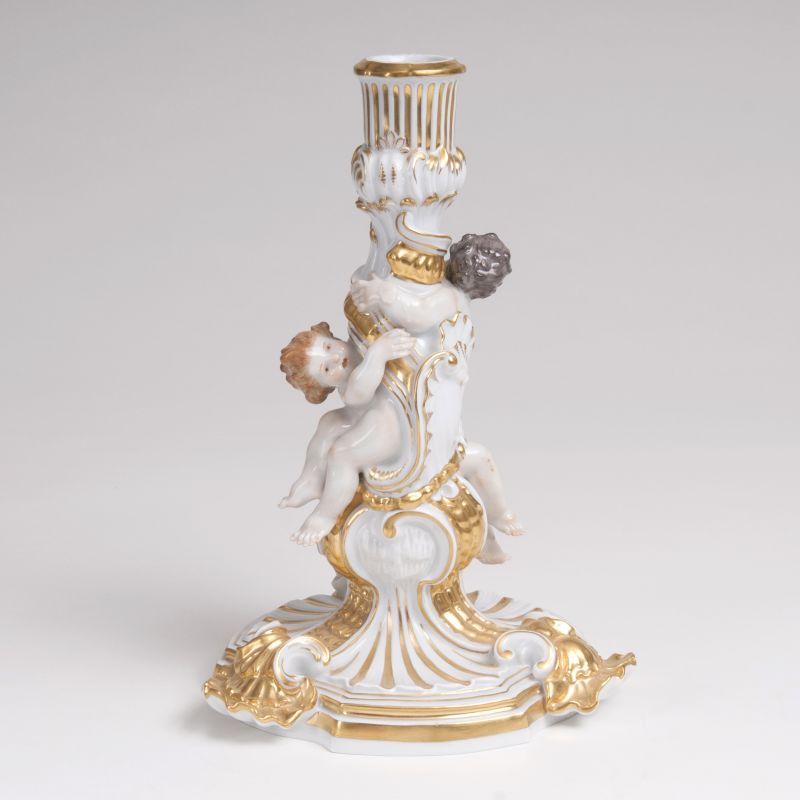 Johann Friedrich Eberlein - A Porcelain Figural Candlestick with Cupids A Porcelain Figural Candlestick with Cupids