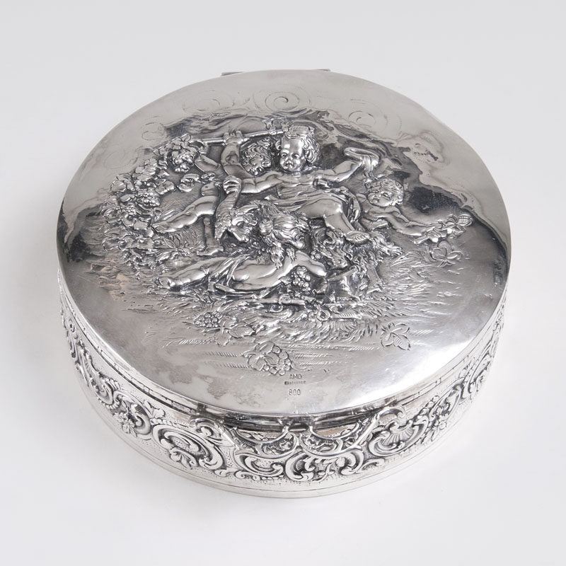 An Imposant Lidded Box with Putti-Scenery