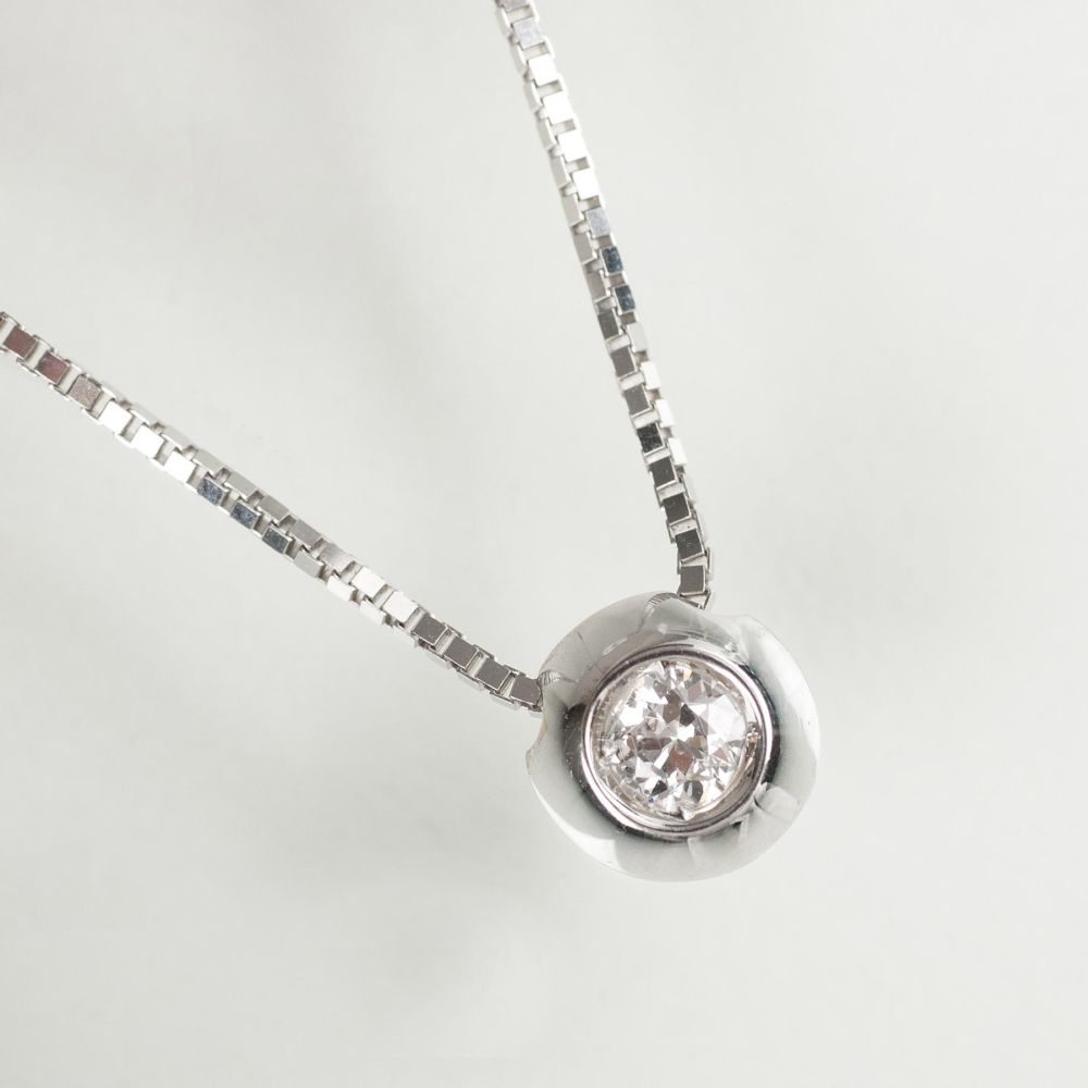 A small Solitaire Diamond Pendant with Necklace