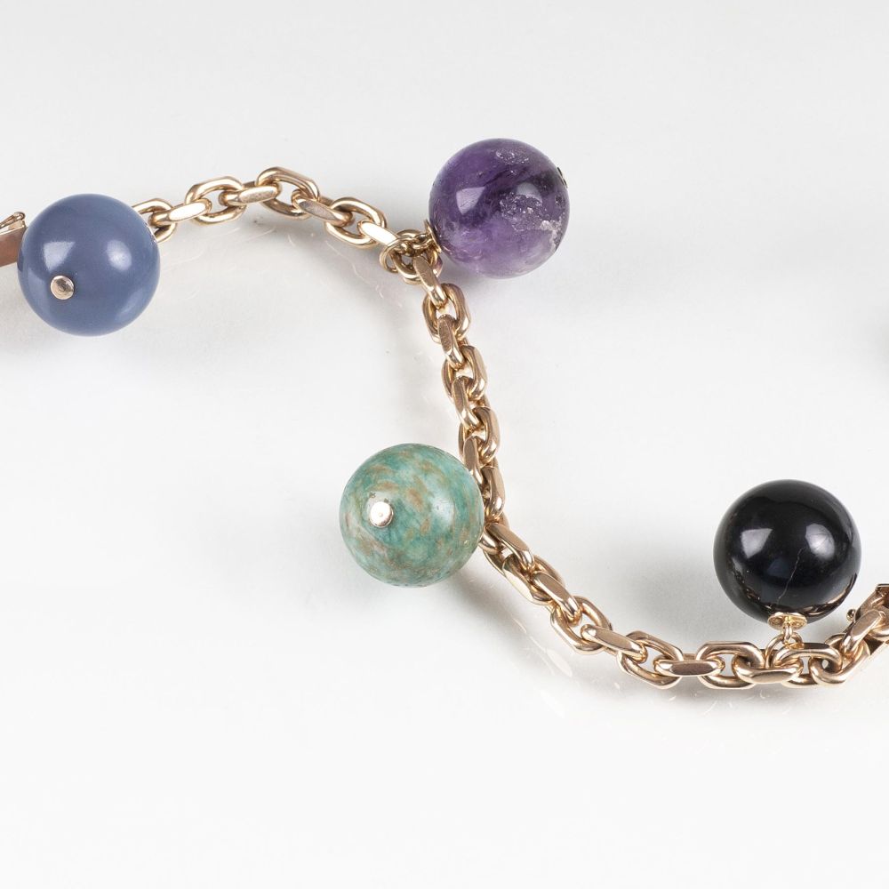 A Gold Bracelet with coloured Gemstones