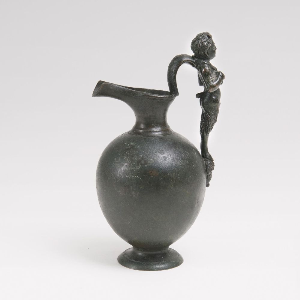 A Small Bronze Pitcher with Satyr