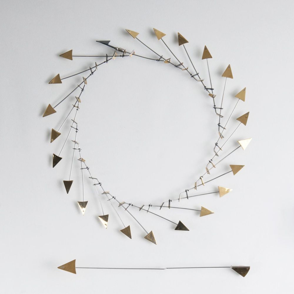 A modern Design Necklace with matching Needle
