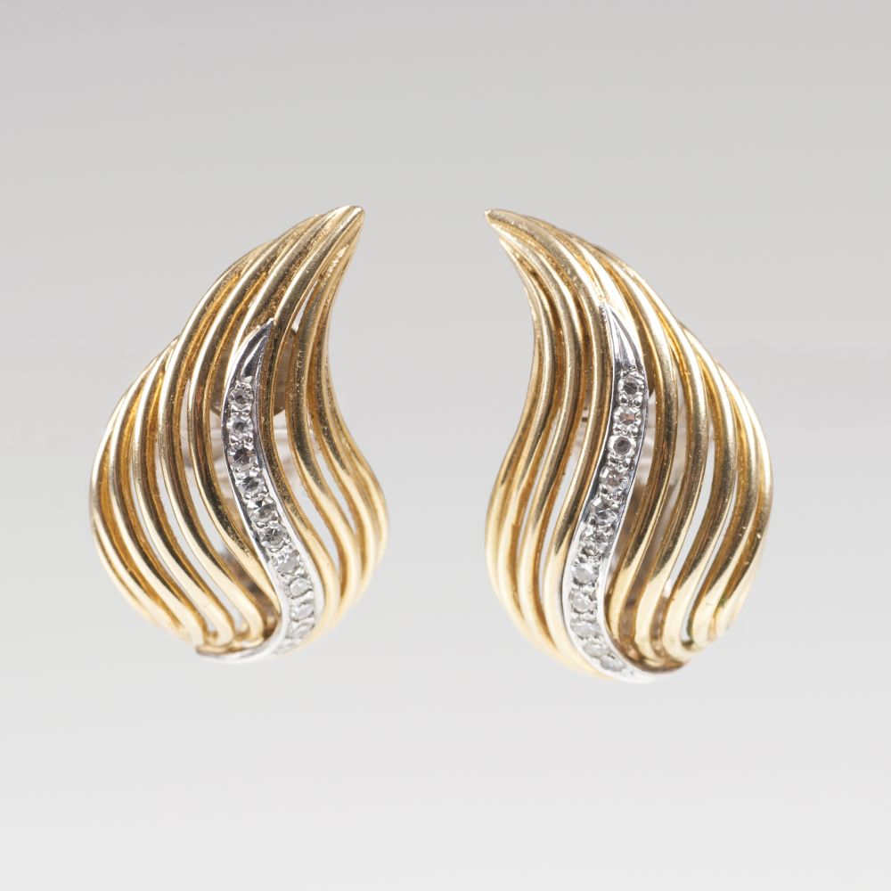 A Pair of Gold Diamond Earrings