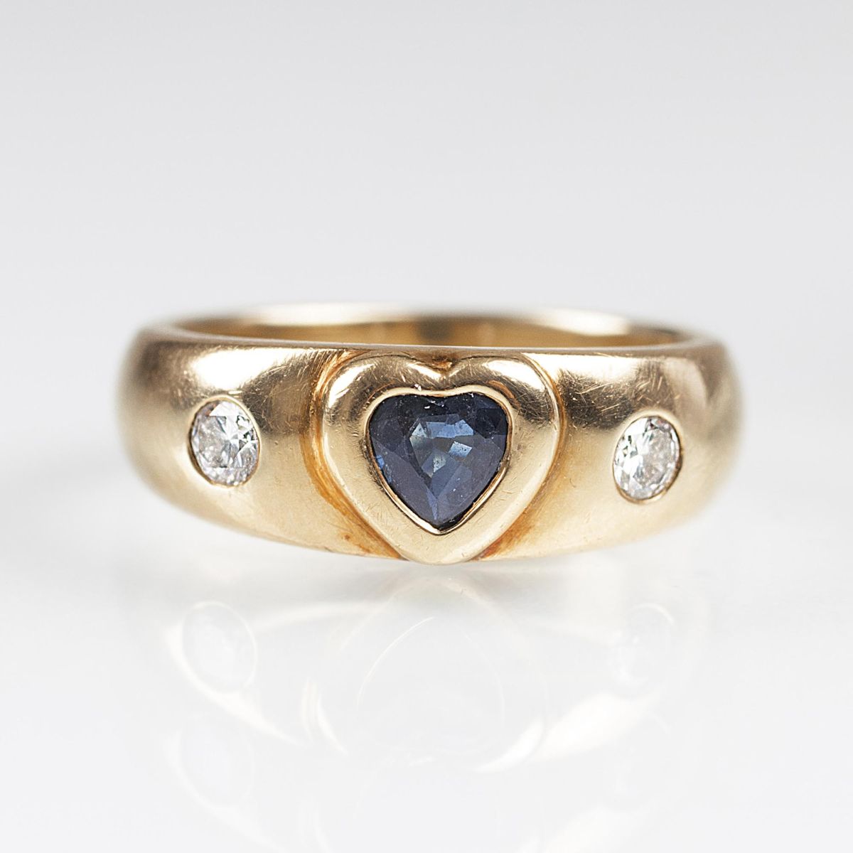 A Gold Ring with Sapphire Heart and Diamonds