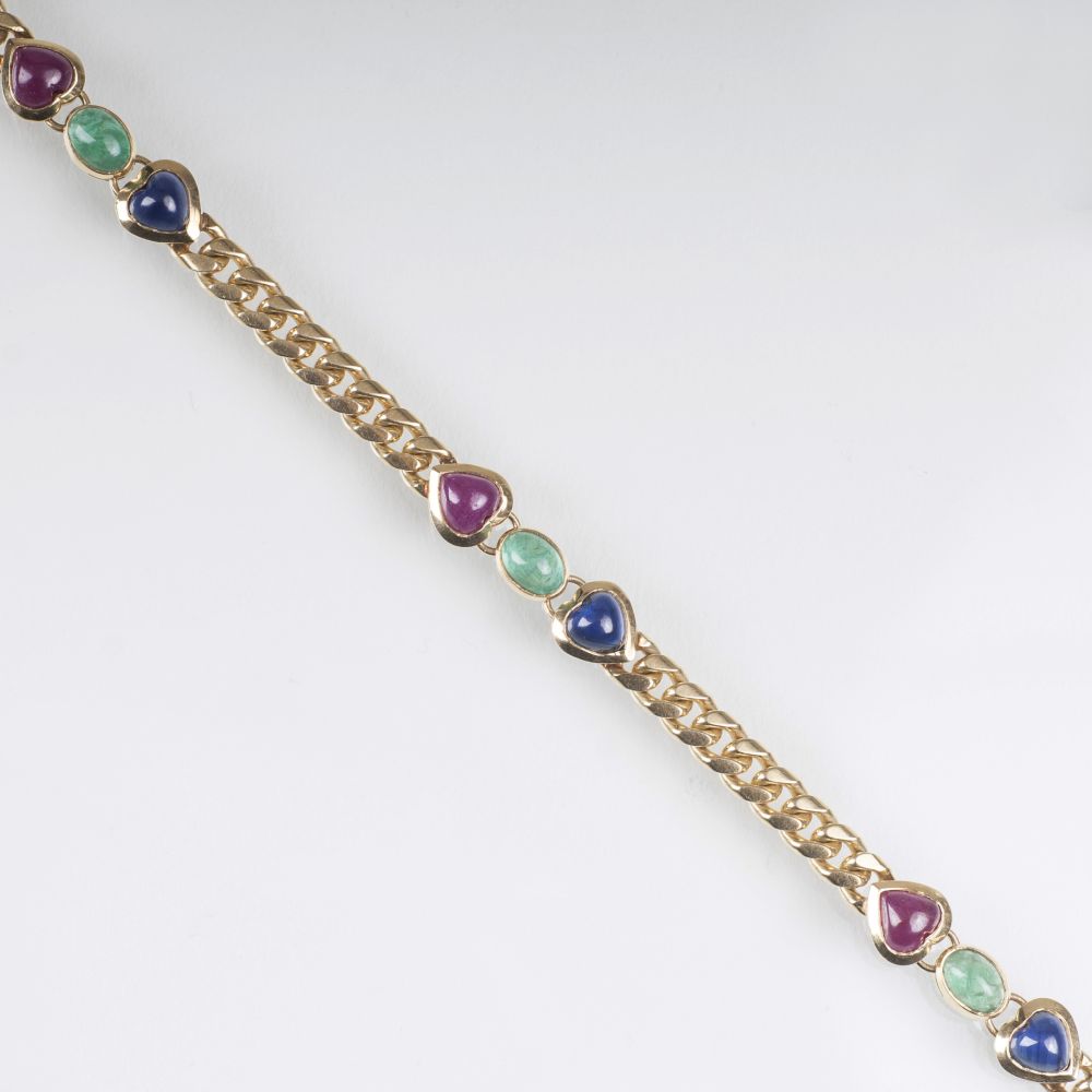 A Gold Bracelet with Sapphires, Emeralds and Rubies