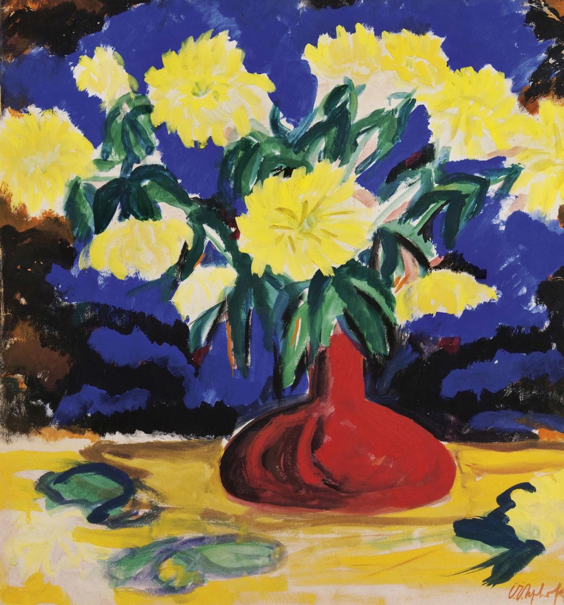 Yellow dahlias in red vase