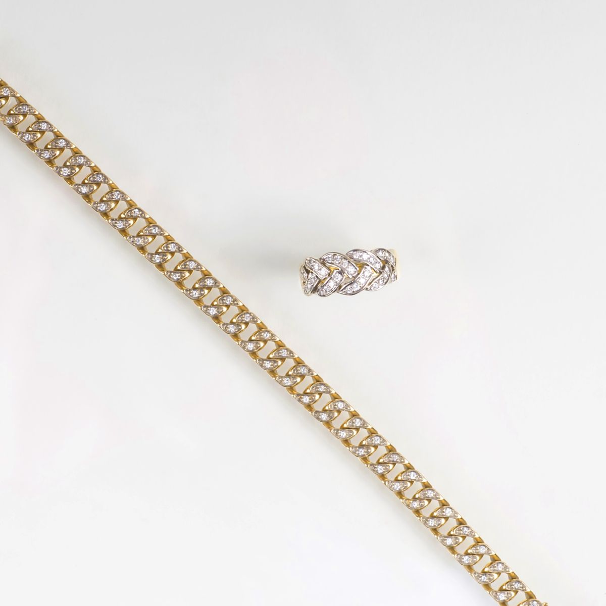 A Gold Diamond Bracelet and a Diamond Ring