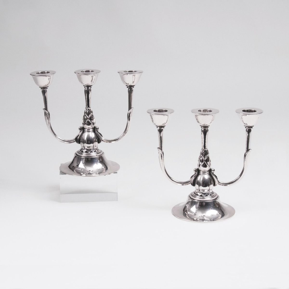 A Pair of Rare Three-Armed Candle Holders