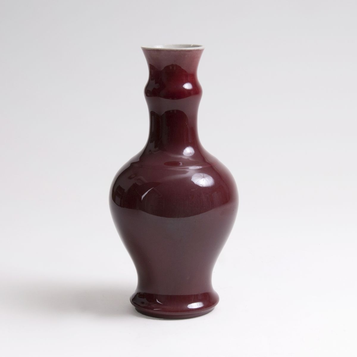 A Garlic-necked Vase with 'Sang de boeuf' Glaze A Garlic-necked Vase with 'Sang de boeuf' Glaze