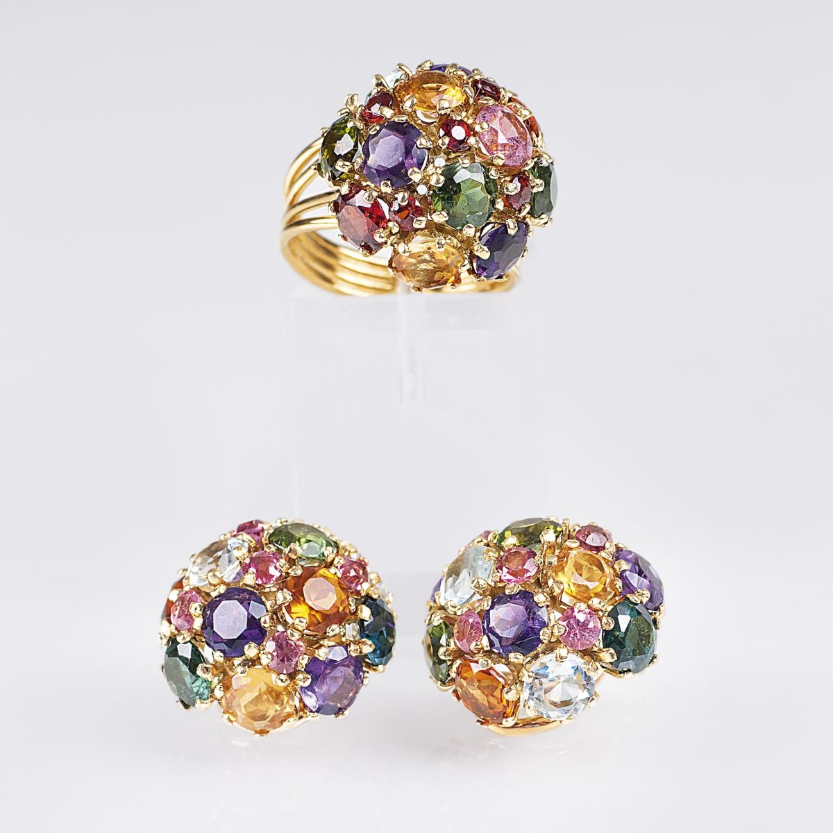 A Coloured Gemstone set: ring and earclips