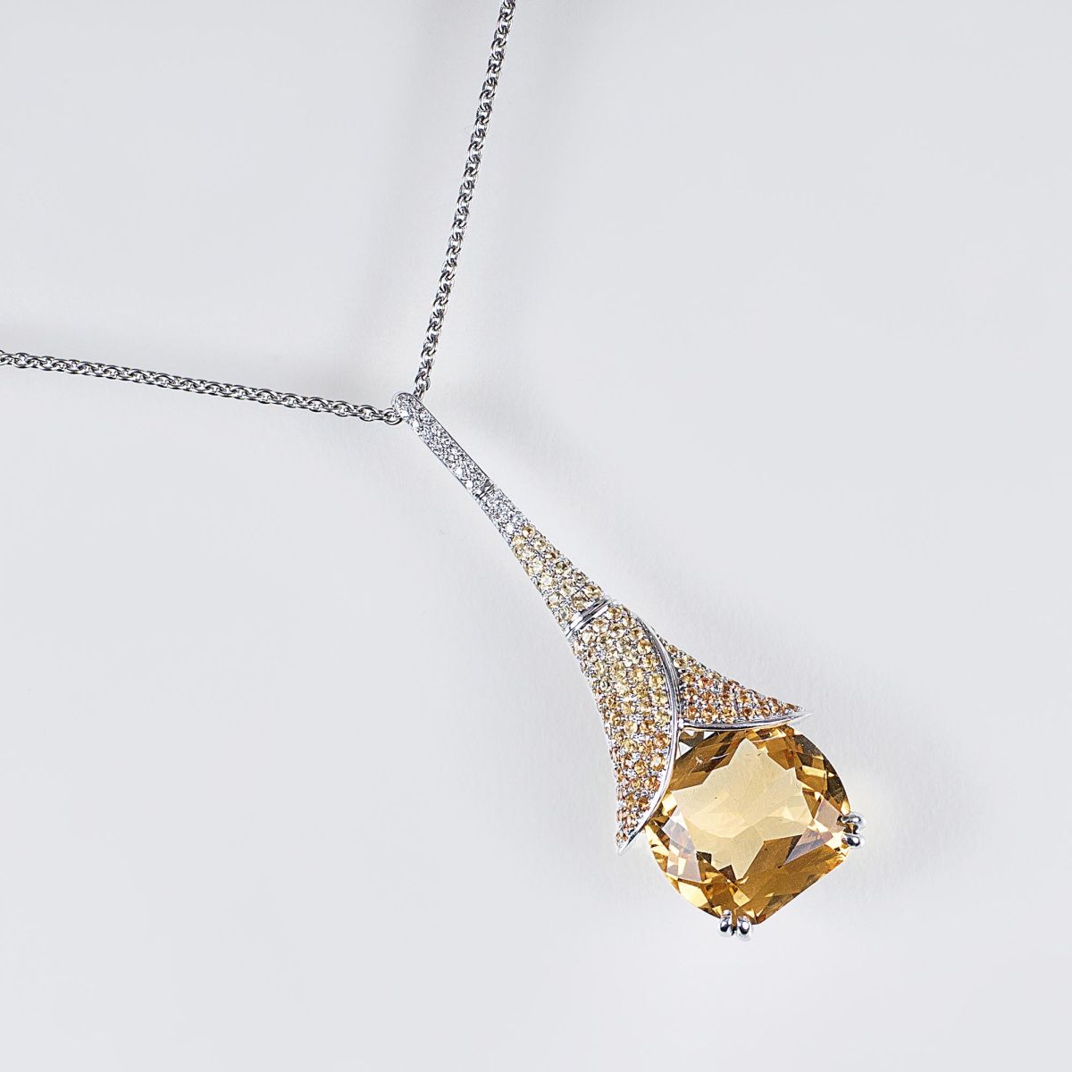 A Citrin Pendant 'Angel Trumpets' with Yellow Sapphires